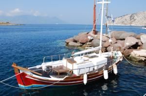 A traditional Caique sits idle in Perdika, Peloponnes, Greece