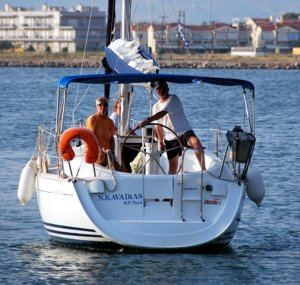 A Greek Sails Sun Odyssey 29.2 sailing yacht lines up for a Mediterranean-style stern-to mooring