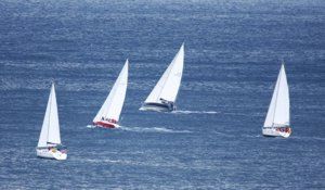 Yachts head out at the beginning of the 2009 Round the Island race, Poros, Greece